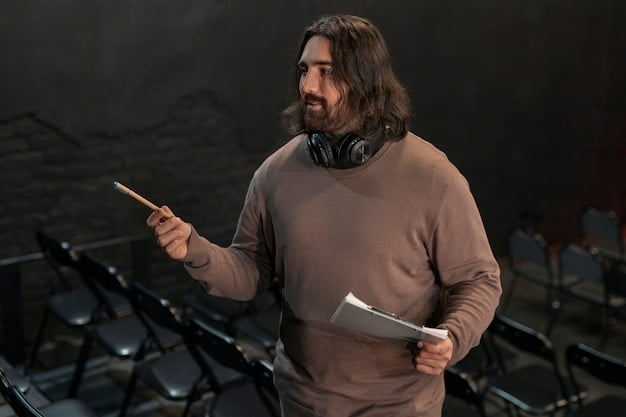 A coach giving feedback during a practice session, using hand gestures to emphasize a point while a player listens attentively.