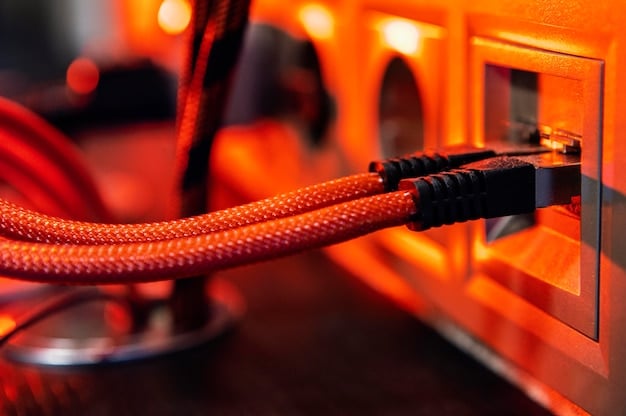 A close-up of an ethernet cable plugged into a gaming router, with a blurry background of a gaming setup, emphasizing the stable wired connection.