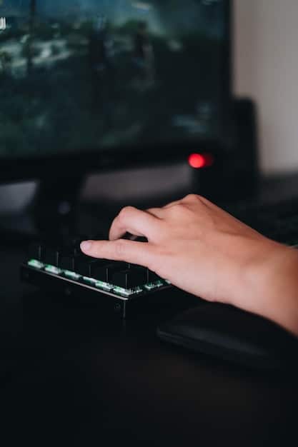 A close-up of a gamer's hand navigating the Steam storefront interface, with highlighted wishlists and discounted game tiles visible on a screen, surrounded by subtle gaming peripherals.