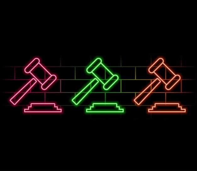 A stylized gavel striking a block with a pixelated esports controller icon, surrounded by digital lines, symbolizing justice and regulation in competitive gaming. The image implies decisive action.