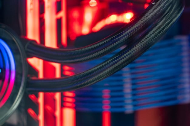 A detailed shot of an AIO liquid cooler radiator mounted at the top of a PC case, with fans visible beneath, and the tubing gracefully leading to the CPU block. Clean cable management.