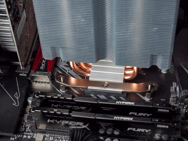 A close-up shot of a high-performance graphics card (GPU) installed in a gaming PC. The focus is on the intricate details of the cooling system and the connections to the motherboard. The image represents the core component needed for a good 1440p experience when 