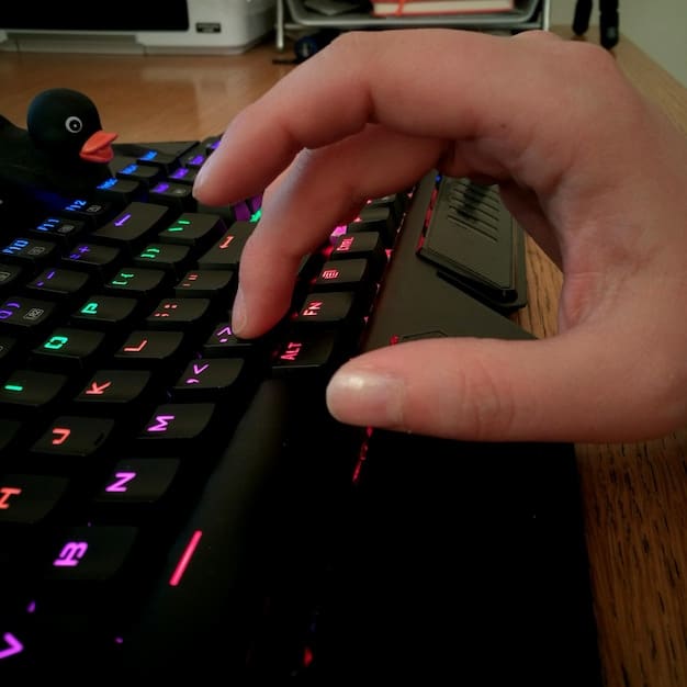 A close-up shot of a gamer's hands hovering over a keyboard and mouse, with the Steam application open on the monitor. The focus is on preparation and anticipation for the upcoming Steam Summer Sale deals from PC Gaming News: Valve Announces Steam Summer Sale Dates and Expected Discounts.
