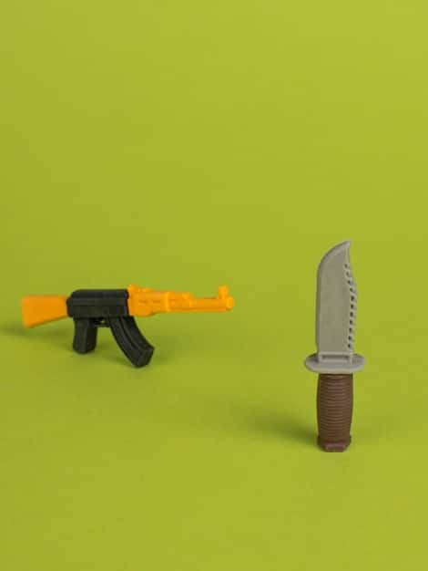 An image showing a side-by-side comparison of a weapon in a game. One side shows the original weapon model from the game, while the other side presents a significantly enhanced weapon model created by a mod, showcasing higher resolution textures, more detailed design, and improved visual effects that are emblematic of PC Gaming Mods: The Best Community-Created Content to Enhance Your Gameplay.