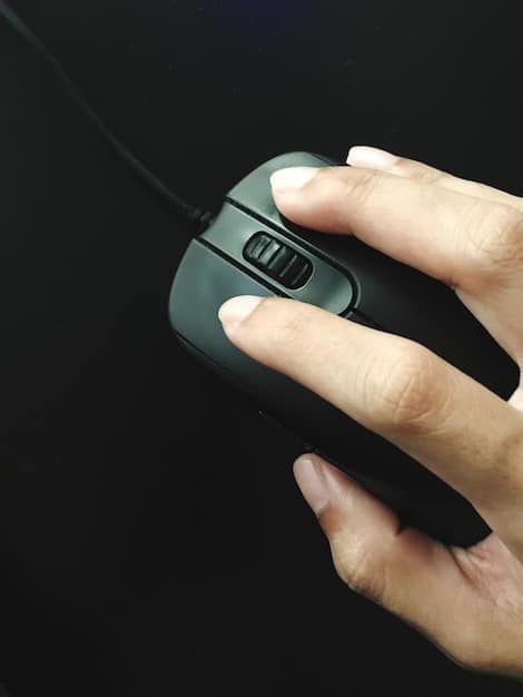 A gamer's hand gripping an ergonomic gaming mouse, illustrating comfort and the custom fit for palm grip, with focus on the textured sides and specialized button placement.