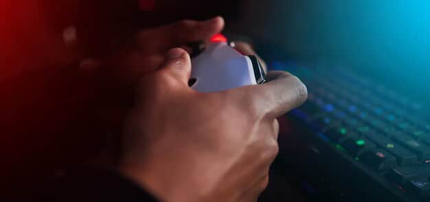 A gamer's hand gripping a mouse, with a blurry background of a competitive FPS game in action on a monitor, emphasizing the need for precise tracking to hit targets.