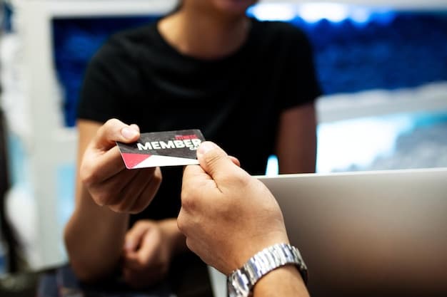 A close-up shot showcasing business cards being exchanged between two individuals at an esports tournament in the US. The focus is on the hands and the cards, symbolizing the tangible exchange of contact information and the first step in developing valuable relationships through Esports Tournament Networking: Building Connections for Future Opportunities in the US.