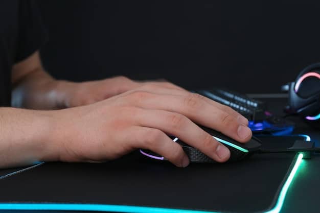 A gamer's hand resting on a high-performance gaming mouse, with a blurred screen in the background displaying in-game action, symbolizing the player's connection to the game and the underlying anti-cheat system.