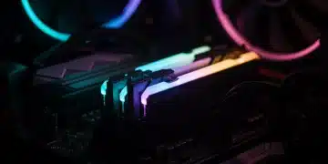DDR5 RAM stick glowing in a high-end gaming PC motherboard